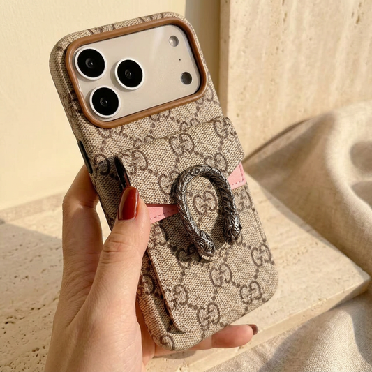 Upright hand-held GG design case with pink pocket inserts, a wide camera opening and silver-tone oval hardware.