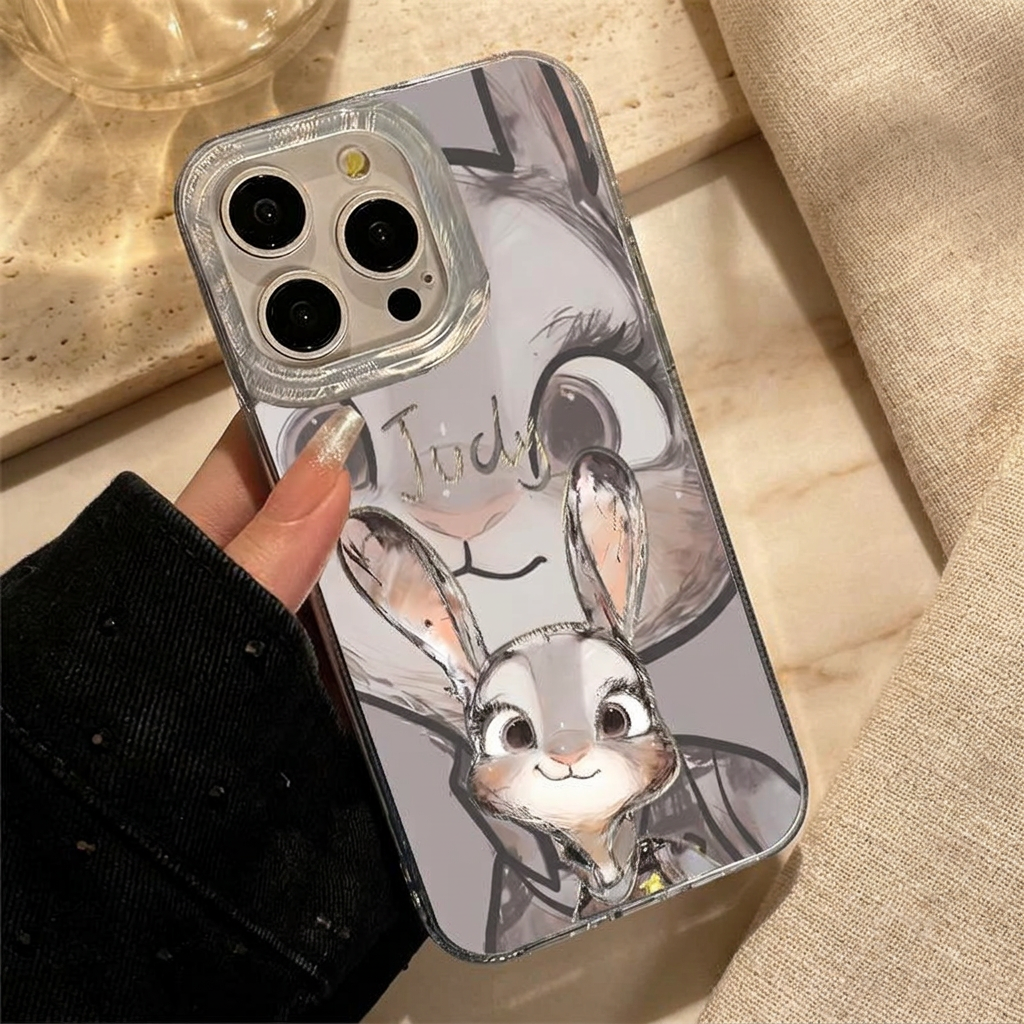 Close hand-held Judy case with a grey rabbit-face background, smaller rabbit portrait, silver-tone Judy name and clear-looking camera surround.