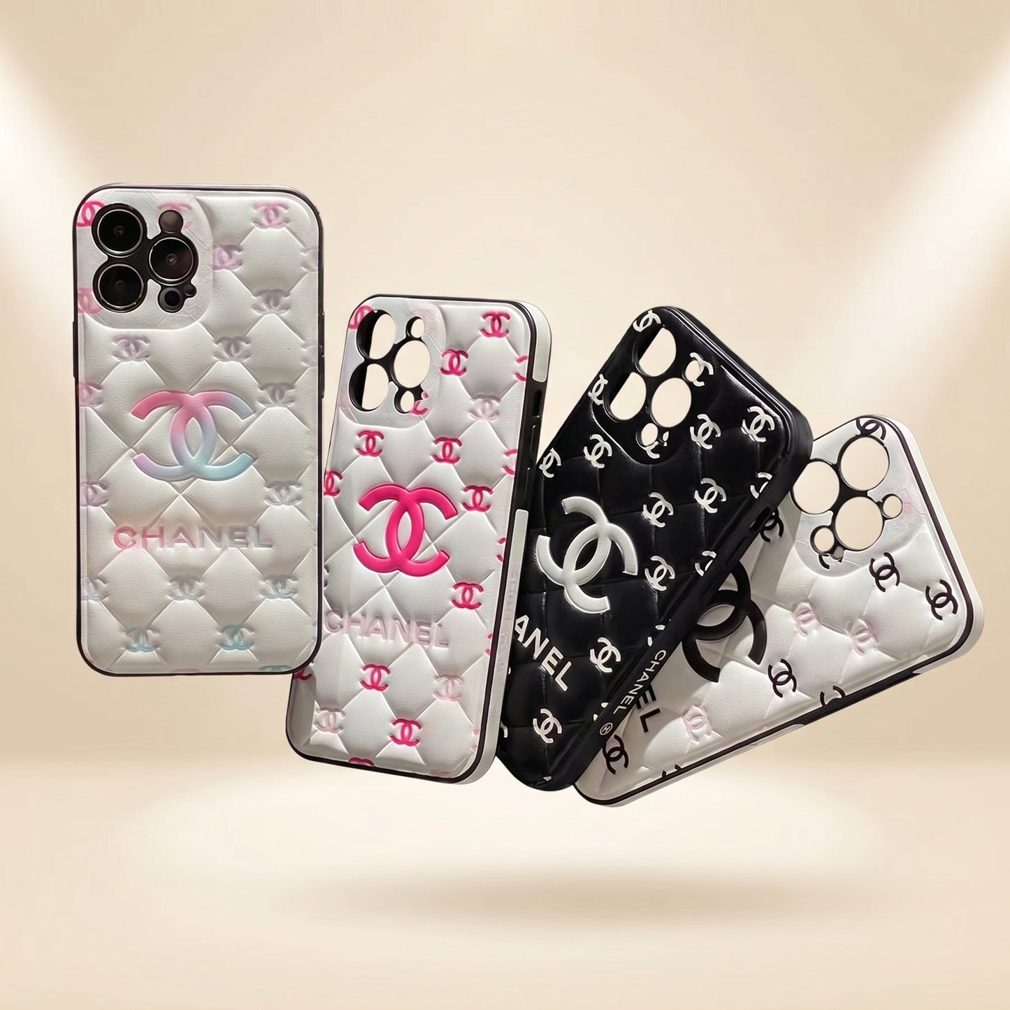 Four Chanel phone cases on a beige background