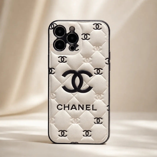 Chanel IPhone case with quilted design on a beige background