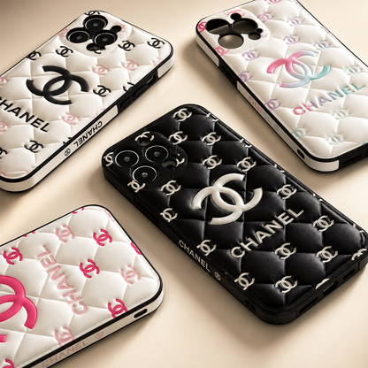 Chanel phone cases with quilted design and brand logo on a beige background