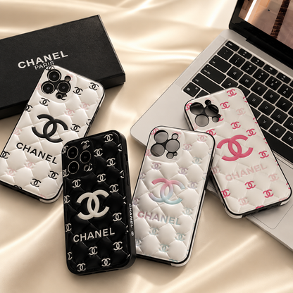 Chanel IPhone case Chanel phone cases on a beige surface with a laptop.