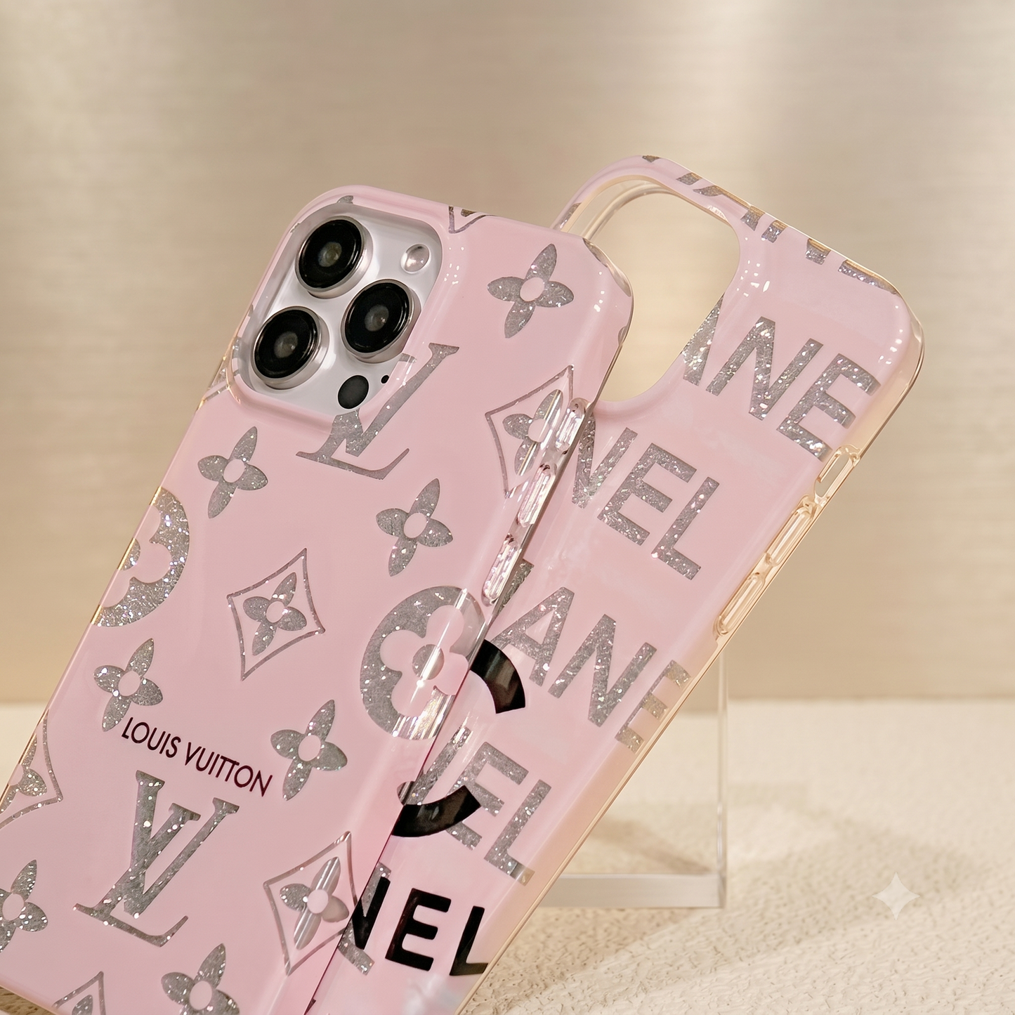 Pink iPhone case 17 Pro Max with Louis Vuitton branding on a beige background