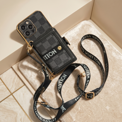 Louis Vuitton phone case with strap on a textured surface