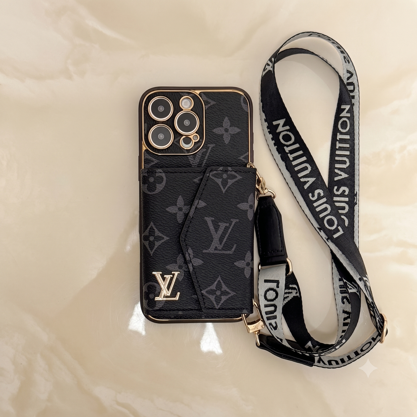 Louis Vuitton iphone case with strap on a black 