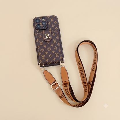 Phone case with monogram pattern and matching strap on a beige background