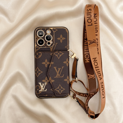 Louis Vuitton phone case with monogram pattern and matching strap on a beige fabric background