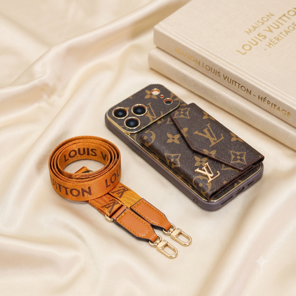 Louis Vuitton phone case and strap on a beige fabric background