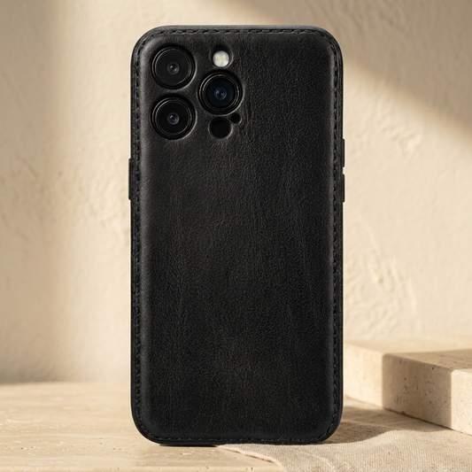 Black vintage-grain case fitted on a display phone, with stitched edges and separate camera openings.