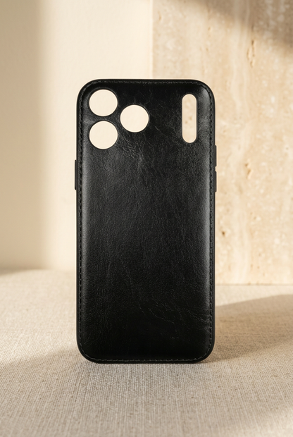 Black stitched empty rear shell with grained texture, three round camera openings and a tall narrow slot.