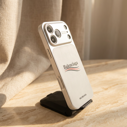 Angled side and rear view of the silver-toned White case showing an upper narrow control, lower elongated control and central name-and-stripe design.