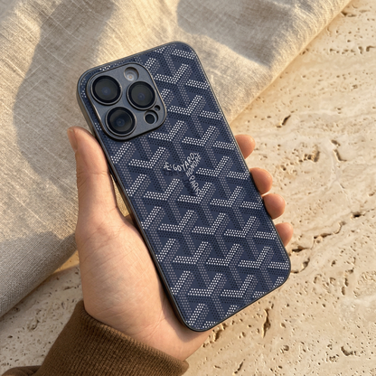 Hand-held deep navy blue back cover with light dotted chevrons, central name detail and dark coordinating camera surround.