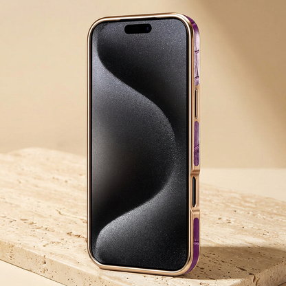 Front screen view with dark grey wallpaper, gold-tone frame and purple croc-pattern side inserts beside the button and opening.