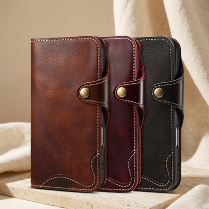 Brown, burgundy-red and black stitched folio cases with closed front covers and brass-tone snap tabs.