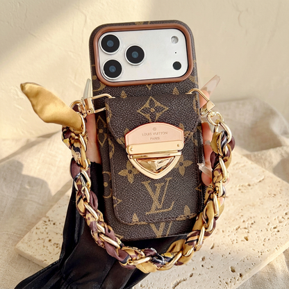 Brown large-motif monogram case with a rear clasp pocket and brown-and-gold scarf chain, showing the large LV motif below the clasp.