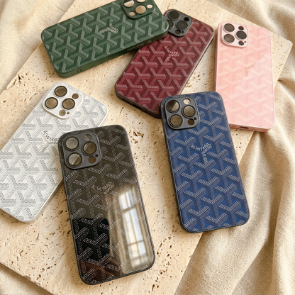 Overlapping green, burgundy red, pale pink, white, black and navy blue chevron-design cases showing their glossy backs and differing camera openings.