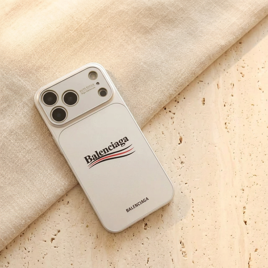 Diagonal flat rear view of the silver-toned White case with black and red curved stripes, smaller lower name detail and a broad camera panel.