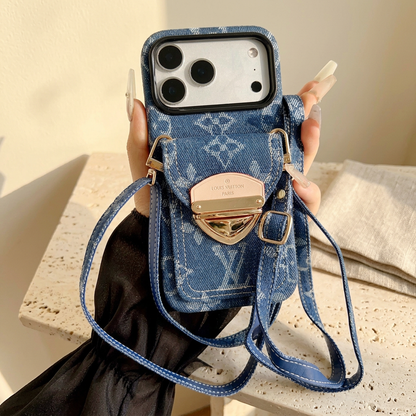 Blue woven-look monogram rear-pocket case held with a matching narrow blue adjustable strap, stitched edges and gold-tone buckle.