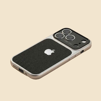 Angled black Urban Zest iPhone case showing textured panel, bottom charging opening and speaker cutouts